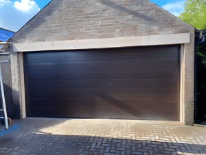 Conversion of Dual Barn Doors into a Single Garage Door